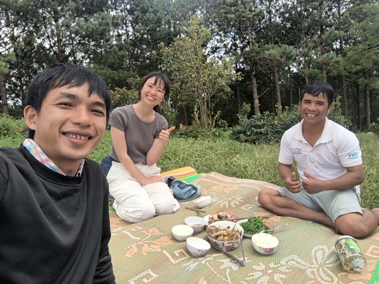 Group photo with local coffee farmers in Xã Lát: Miwa and the author stand side by side with the stewards of the land, united by soil, story, and shared purpose.
